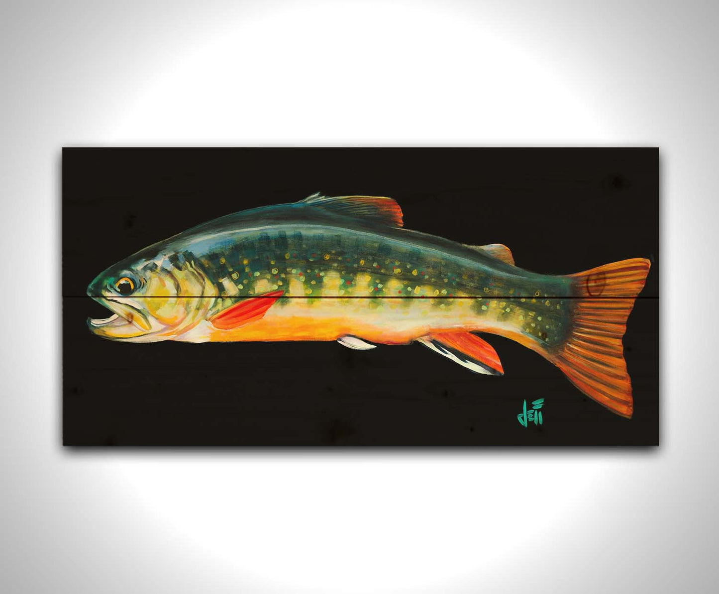 A painting of a colorful brook trout– in green, yellow, and orange– against a bold black background. Printed on a wood pallet.