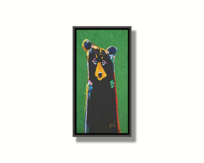 A stylized portrait painting of a black bear depicted as a simplified shape, accented by a spectrum of colorful outlines, and set against a bright green background. Printed on canvas in a float frame.