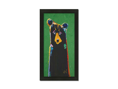 A stylized portrait painting of a black bear depicted as a simplified shape, accented by a spectrum of colorful outlines, and set against a bright green background. Printed on canvas and framed.