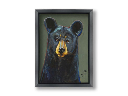 A painting of a black bear, accented with reds and blues, set against a gray-green background. Printed on canvas and framed.