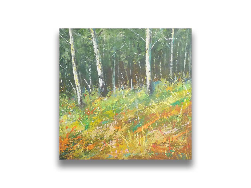 A painting of a hillside forest with colorful grasses in yellows, oranges, and greens. Printed on canvas.