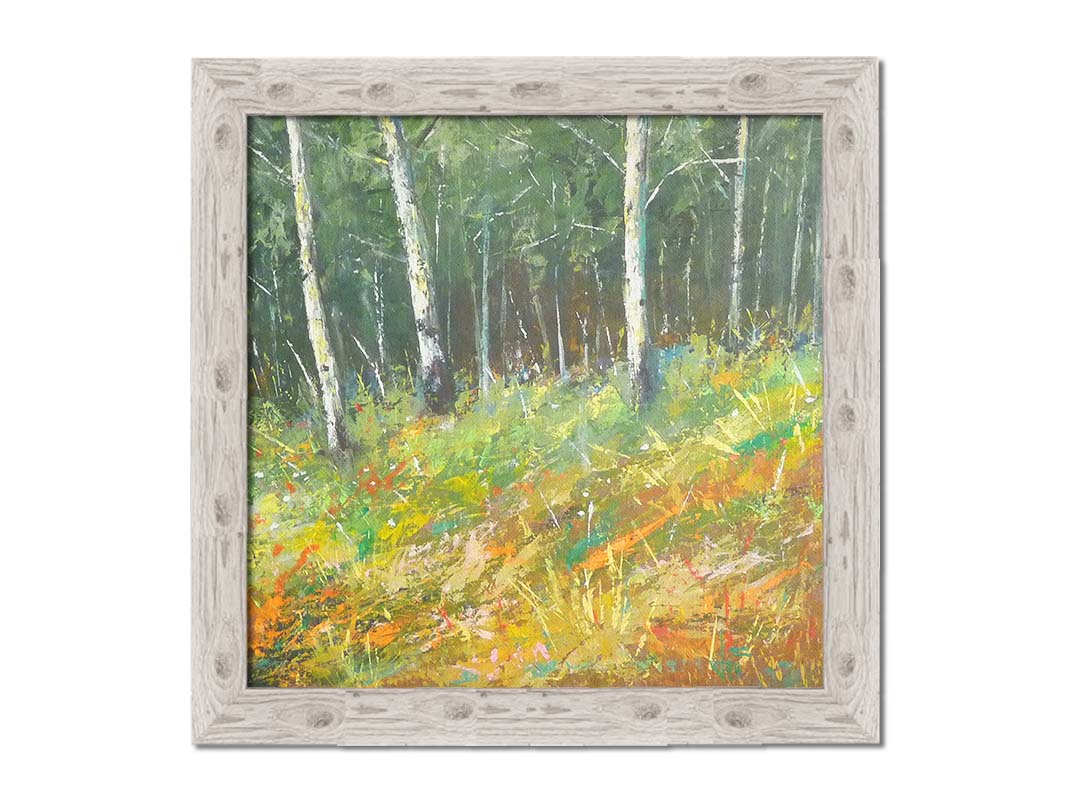 A painting of a hillside forest with colorful grasses in yellows, oranges, and greens. Printed on canvas and framed.