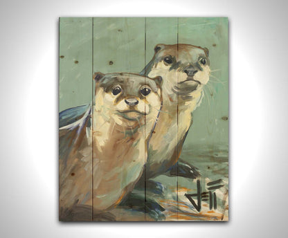 A painting of two otters sitting on the shore, their smooth fur and cool reflections brought to life in subtle natural colors. Printed on a wood pallet.