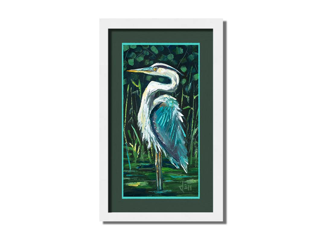 A painting of a great blue heron standing tall in a pond surrounded by vibrant foliage. Printed on paper, matted, and framed.