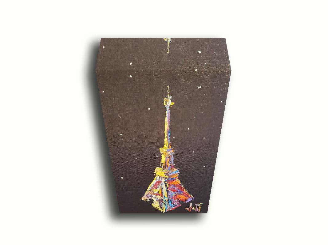 A painting of an abstracted rendition of the iconic Eiffel Tower in bright colors against a black background with white speckles. Printed on canvas.