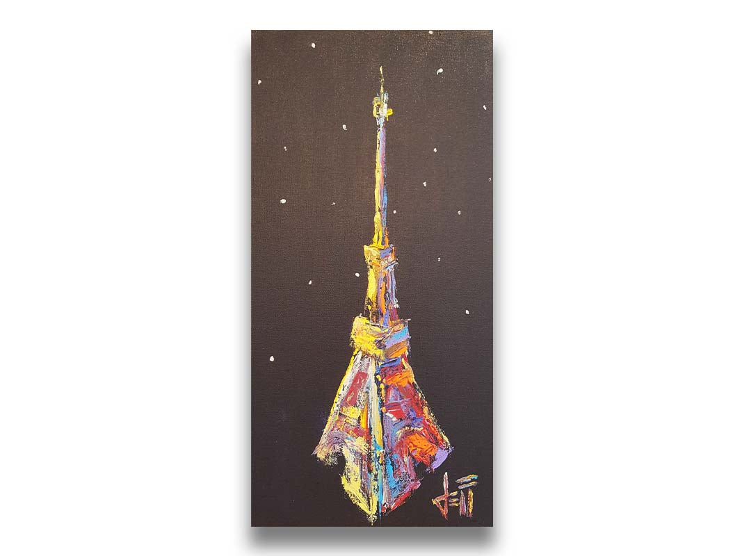 A painting of an abstracted rendition of the iconic Eiffel Tower in bright colors against a black background with white speckles. Printed on canvas.