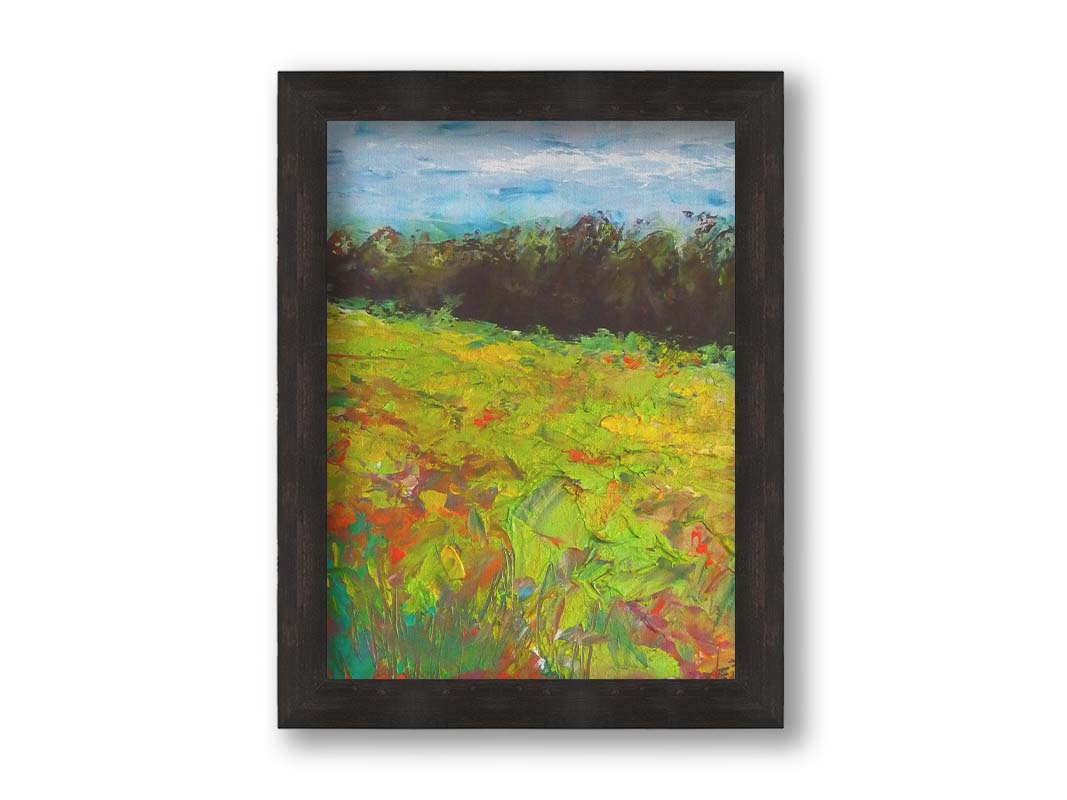 A landscape painting of a colorful meadow bordered by a lush forest, created using vibrant green impasto with pops of orange, pink, yellow, and blue. Printed on canvas and framed.