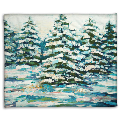 A coral fleece blanket decorated with the print of a painting of a snowy evergreen forest, textured with thick layers of paint. 