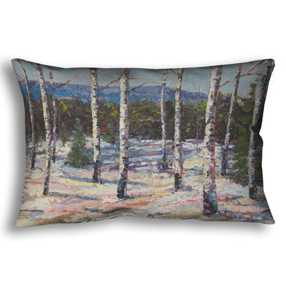 Throw pillow printed with a painting of birch trees in a snowy landscape with mountains in the background.