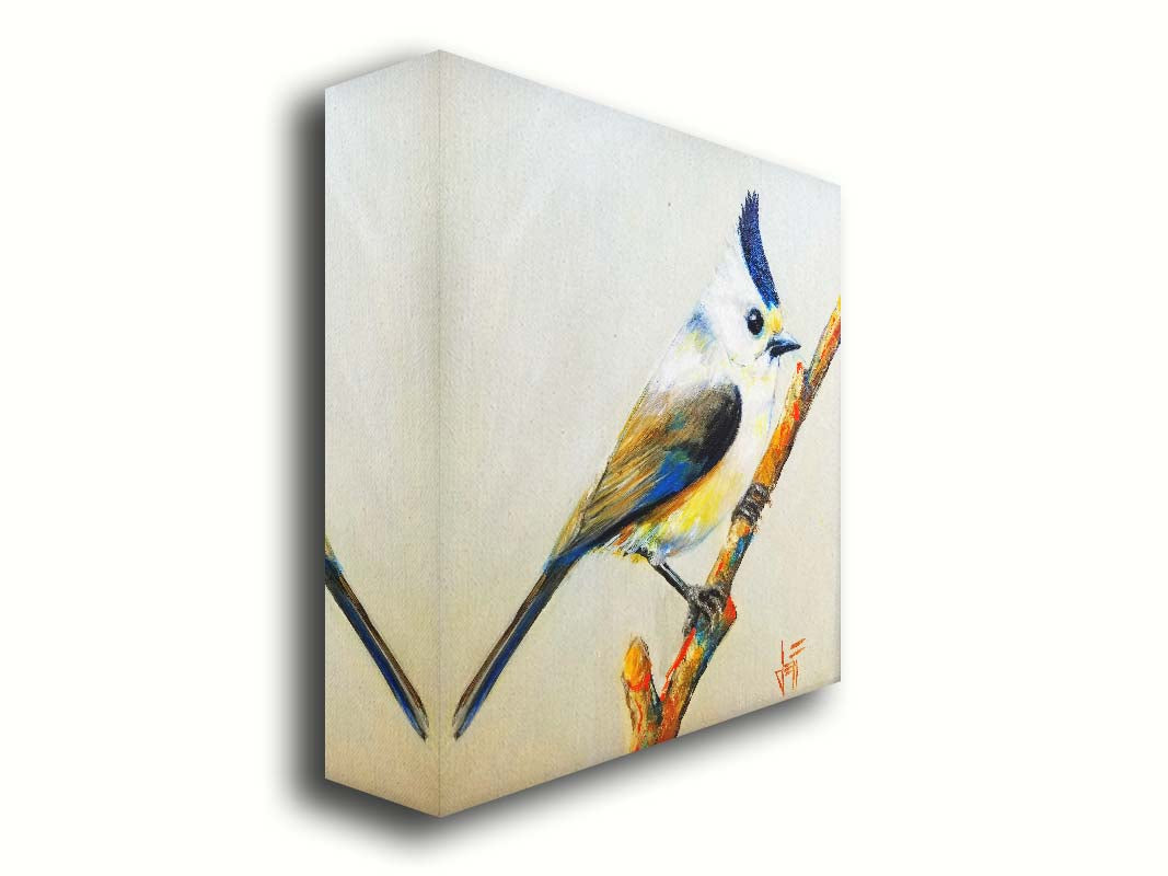 A painting of a titmouse bird with white, yellow, and gray feathers accented with blue perched on a stick, set against an off-white background. Printed on canvas.