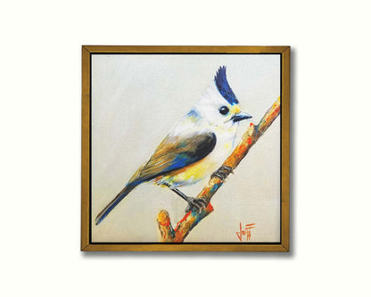 A painting of a titmouse bird with white, yellow, and gray feathers accented with blue perched on a stick, set against an off-white background. Printed on canvas in a float frame.