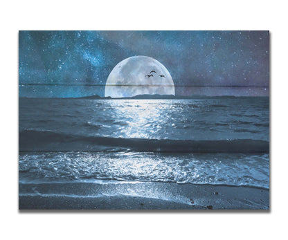 A full moon over the horizon of a calm, dark sea during a starry night. Printed on a box board.