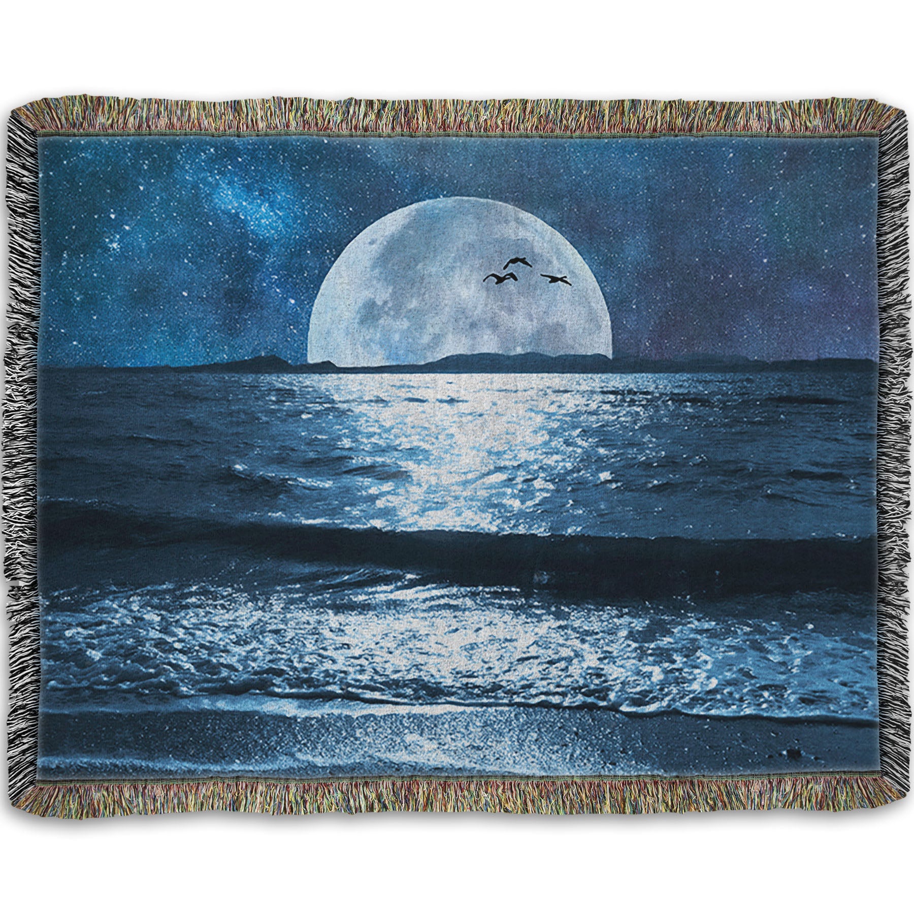 A woven throw blanket designed with a photo of a full moon over the horizon of a calm, dark sea during a starry night.