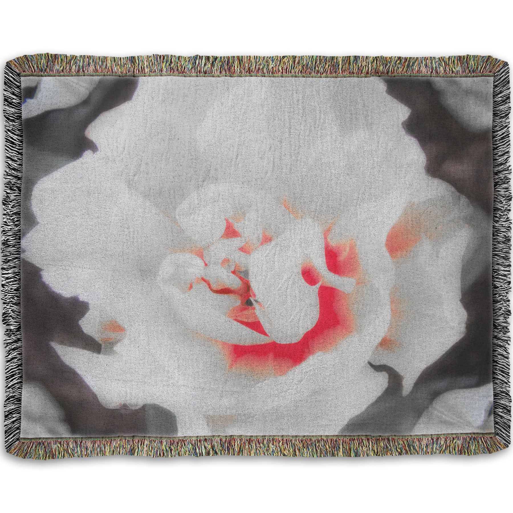A woven throw blanket designed with a closeup photograph of a fancy tulip in grayscale, with one pop of pink and red in the center.