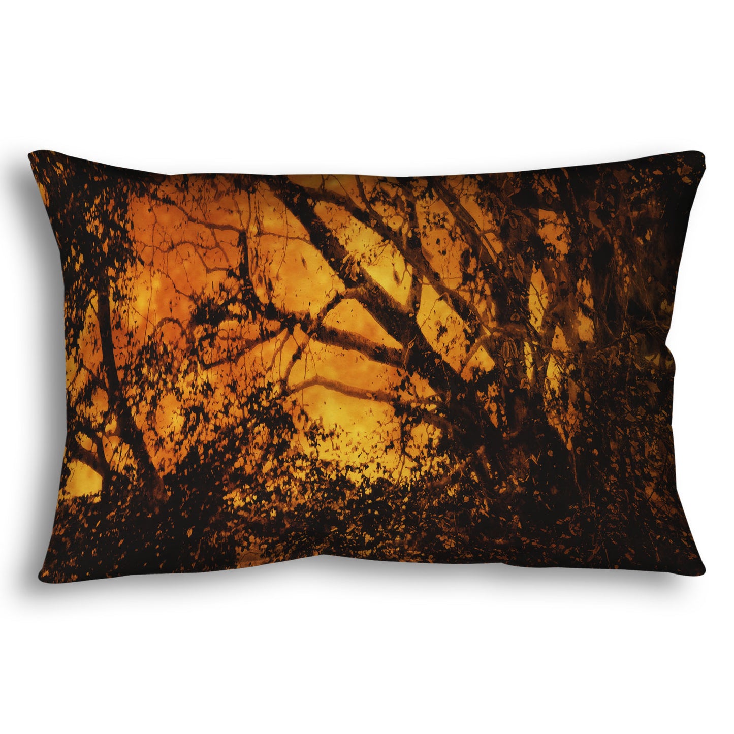 A throw pillow designed with a photo of the black shadow of a tree superimposed over a bright orange full moon.