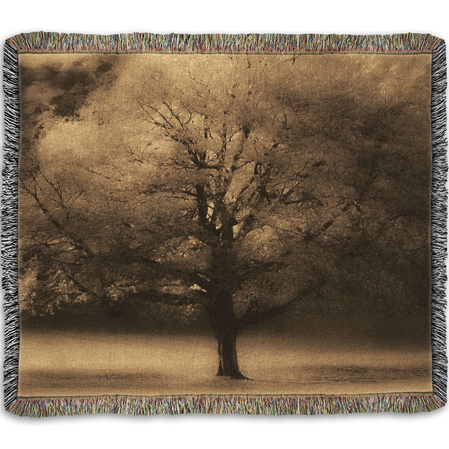 A woven throw blanket designed with an edited photo of a large, isolated tree in fall, colored in sepia tone.