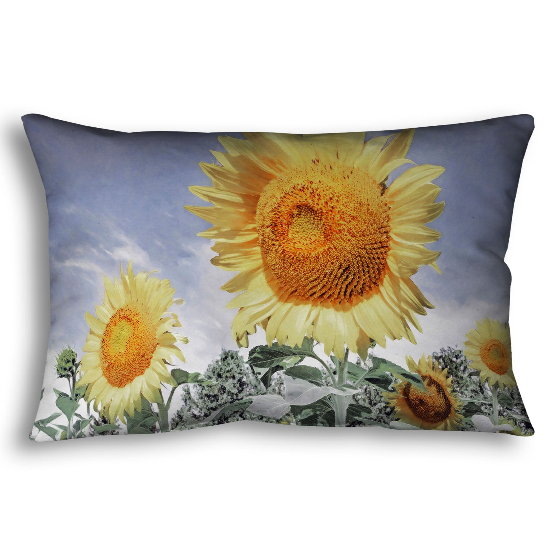A throw pillow designed with a desaturated photo of a group of yellow sunflowers against a blue sky. 
