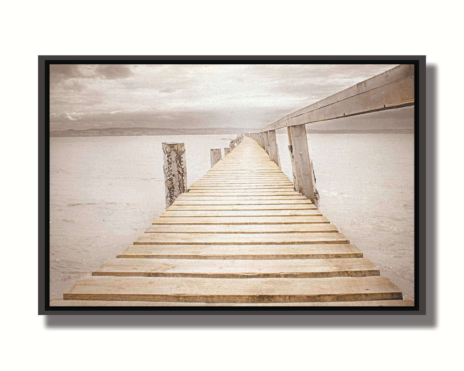 A photo looking along a pier out into the water, edited in a sepia tone. Printed on canvas in a float frame.