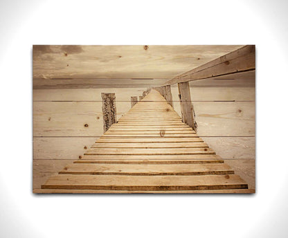 A photo looking along a pier out into the water, edited in a sepia tone. Printed on a wood pallet.