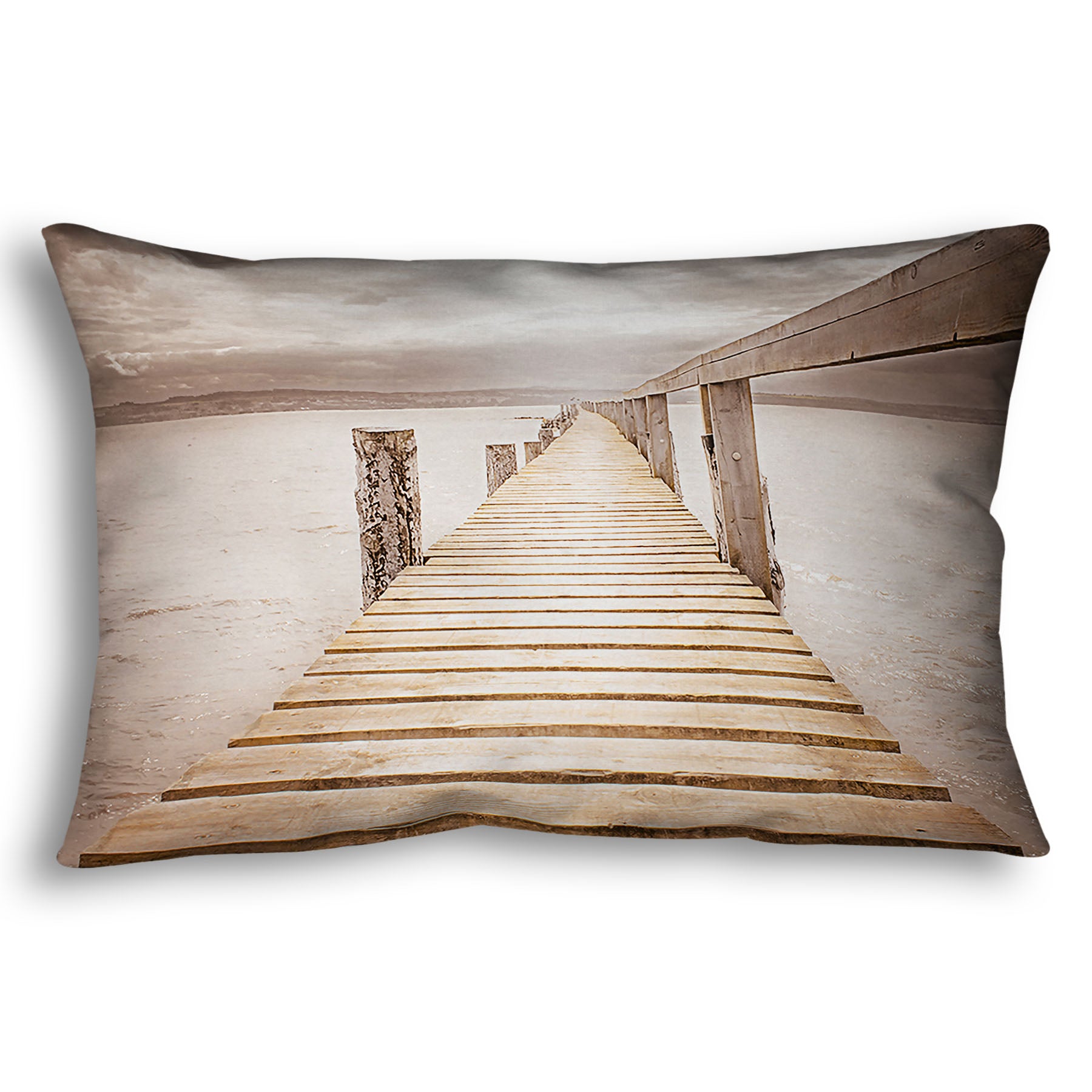 A throw pillow designed with a photo looking along a pier out into the water, edited in a sepia tone.