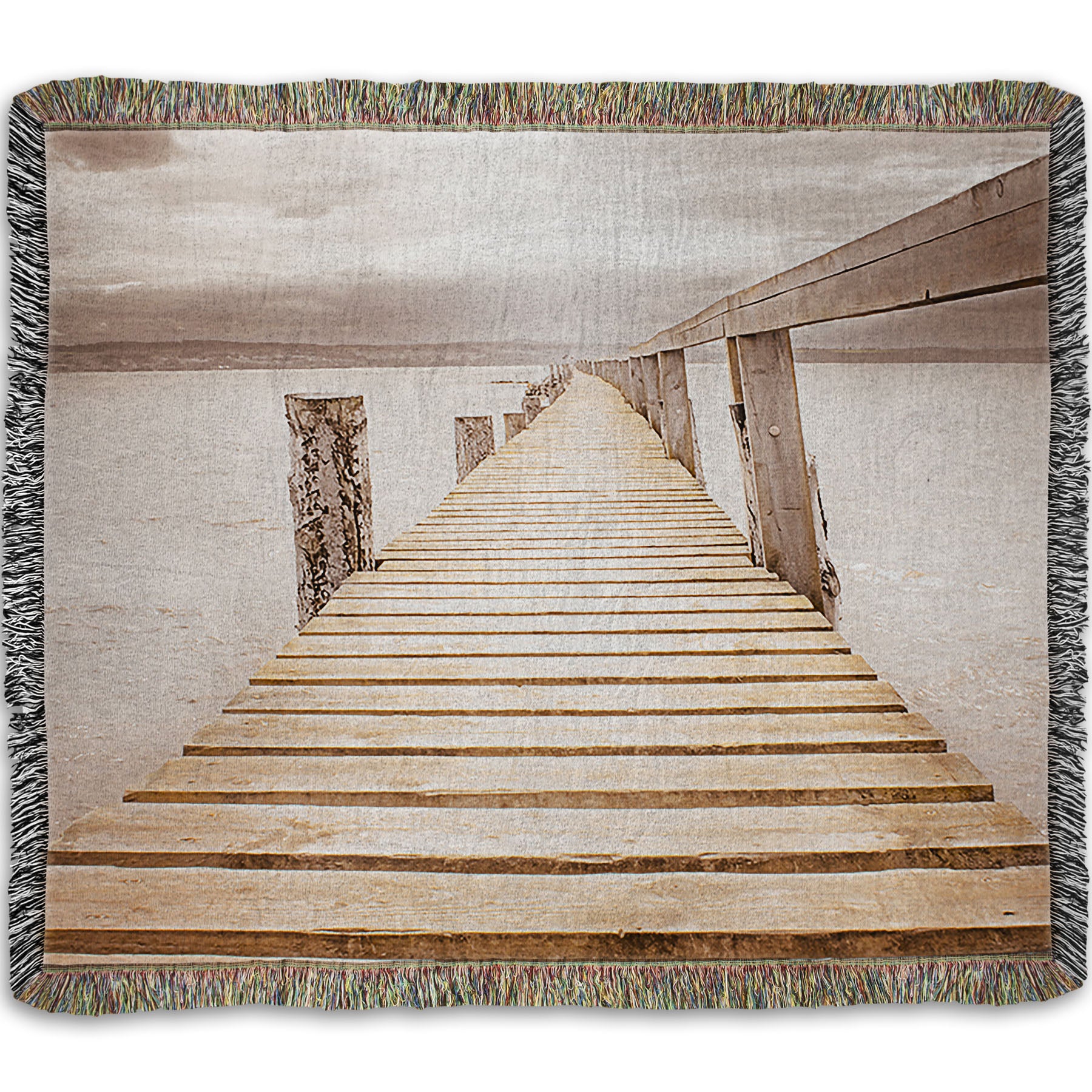 A woven throw blanket designed with a photo looking along a pier out into the water, edited in a sepia tone.