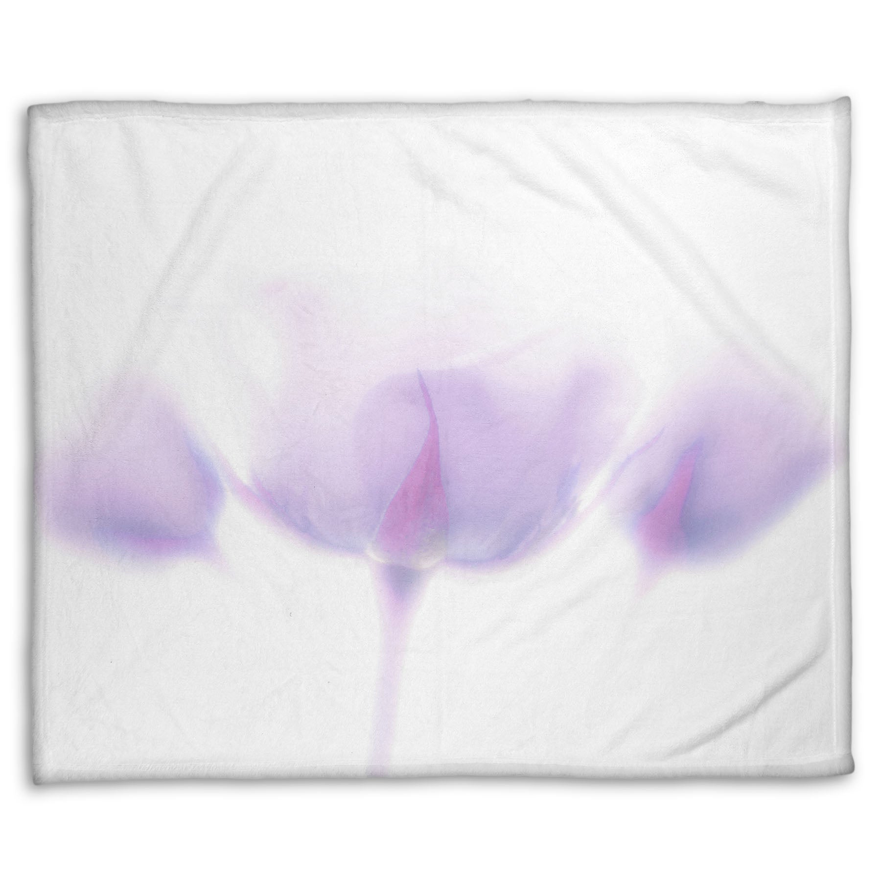 A fleece throw blanket designed with a  photo of three pale purple roses against a pure white background, enveloped in a gentle white glow.