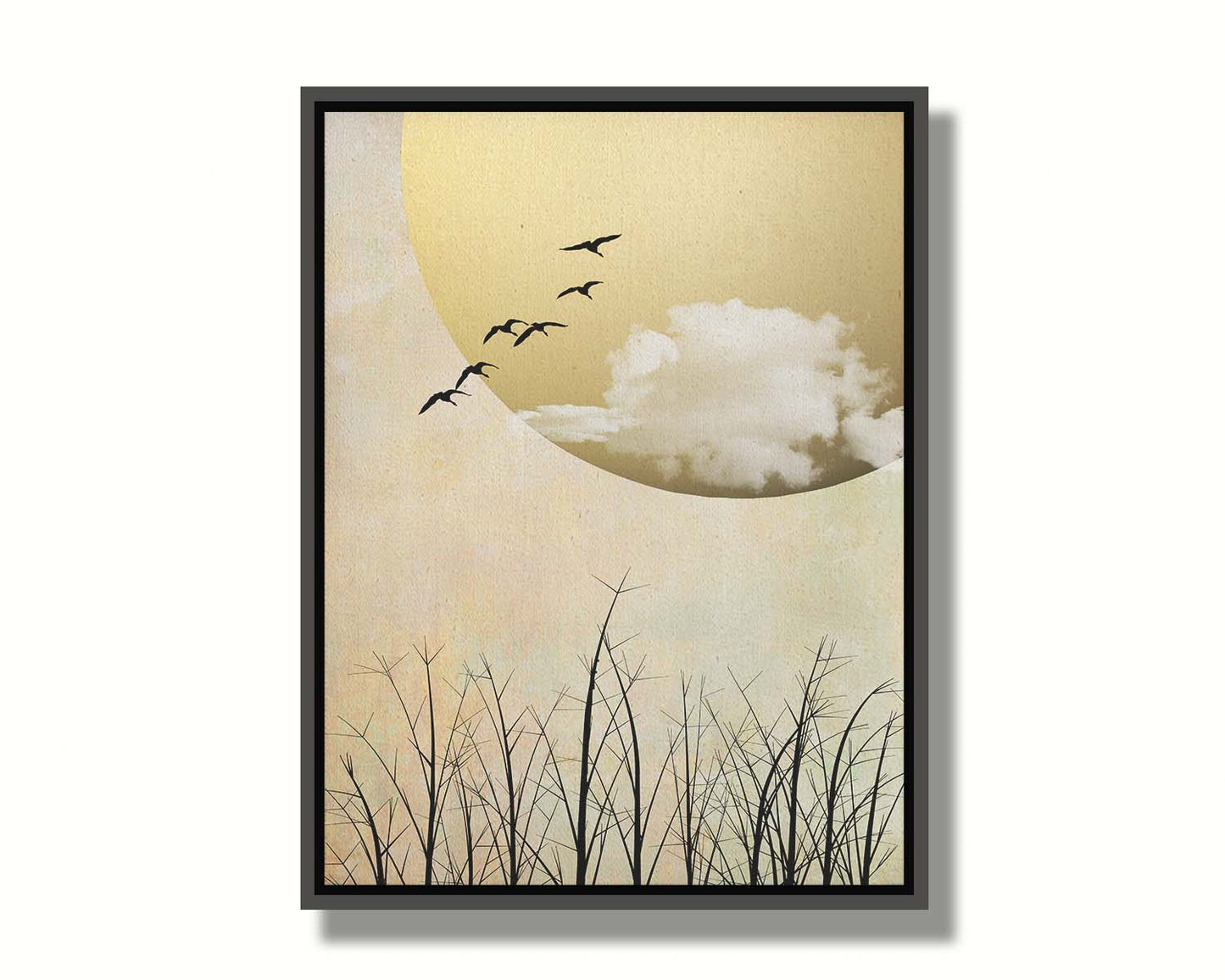 A photo collage art piece of migratory birds flying south for the winter, silhouetted against a big gold moon. Printed on canvas in a float frame.