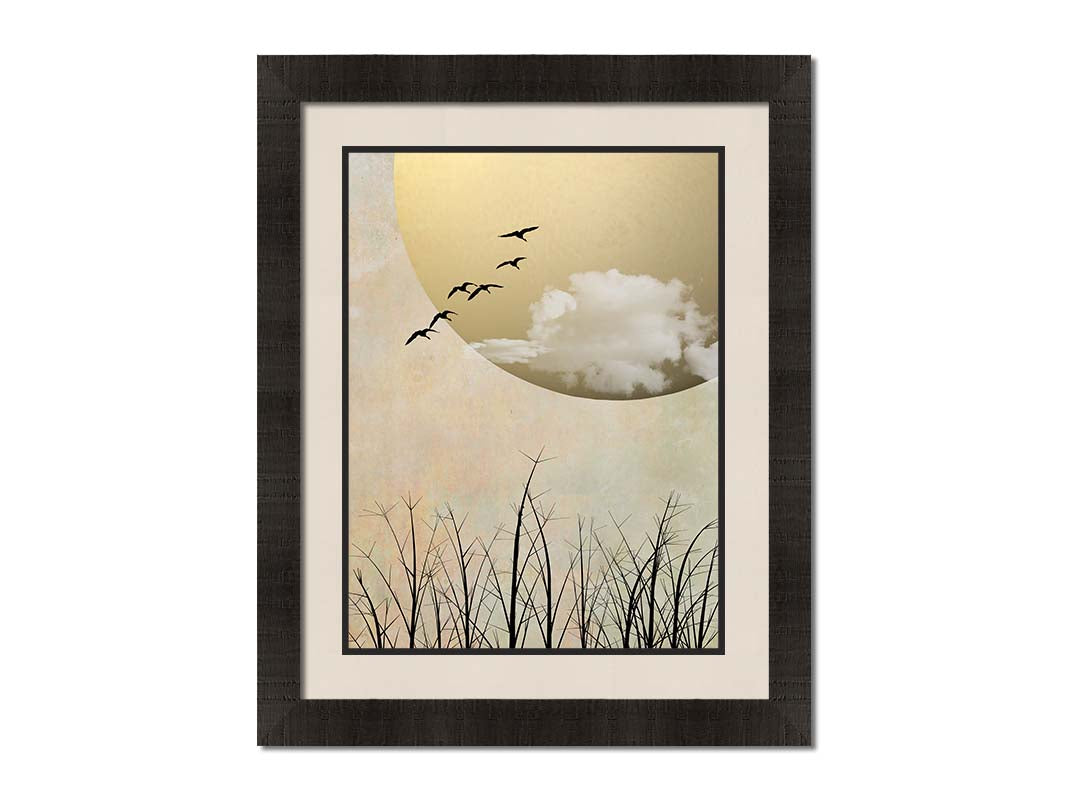 A photo collage art piece of migratory birds flying south for the winter, silhouetted against a big gold moon. Printed on paper, matted, and framed.