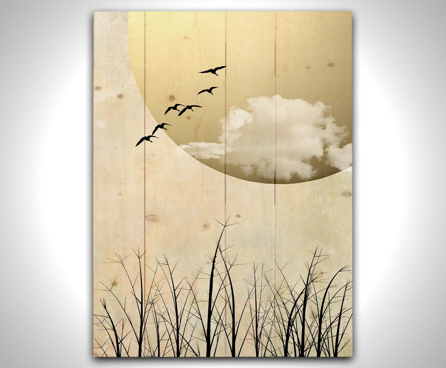 A photo collage art piece of migratory birds flying south for the winter, silhouetted against a big gold moon. Printed on a wood pallet.