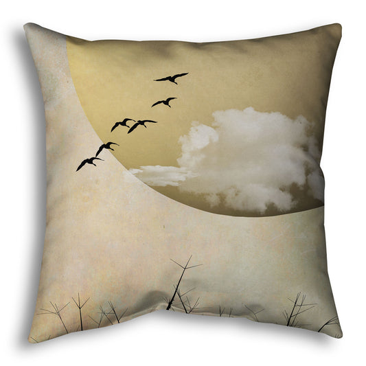Throw pillow designed with a photo collage of migratory birds flying south for the winter, silhouetted against a big gold moon. 