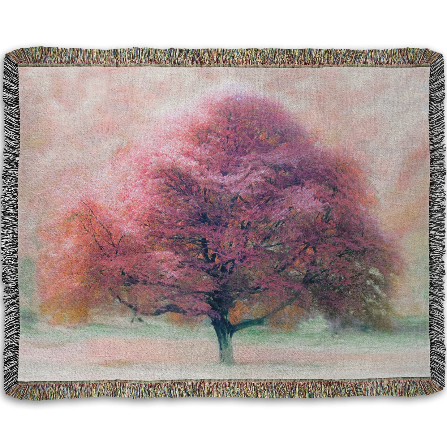 A woven throw blanket designed with an edited photo of a beech tree, its leaves pink for autumn. It has been modified to have a painterly look.