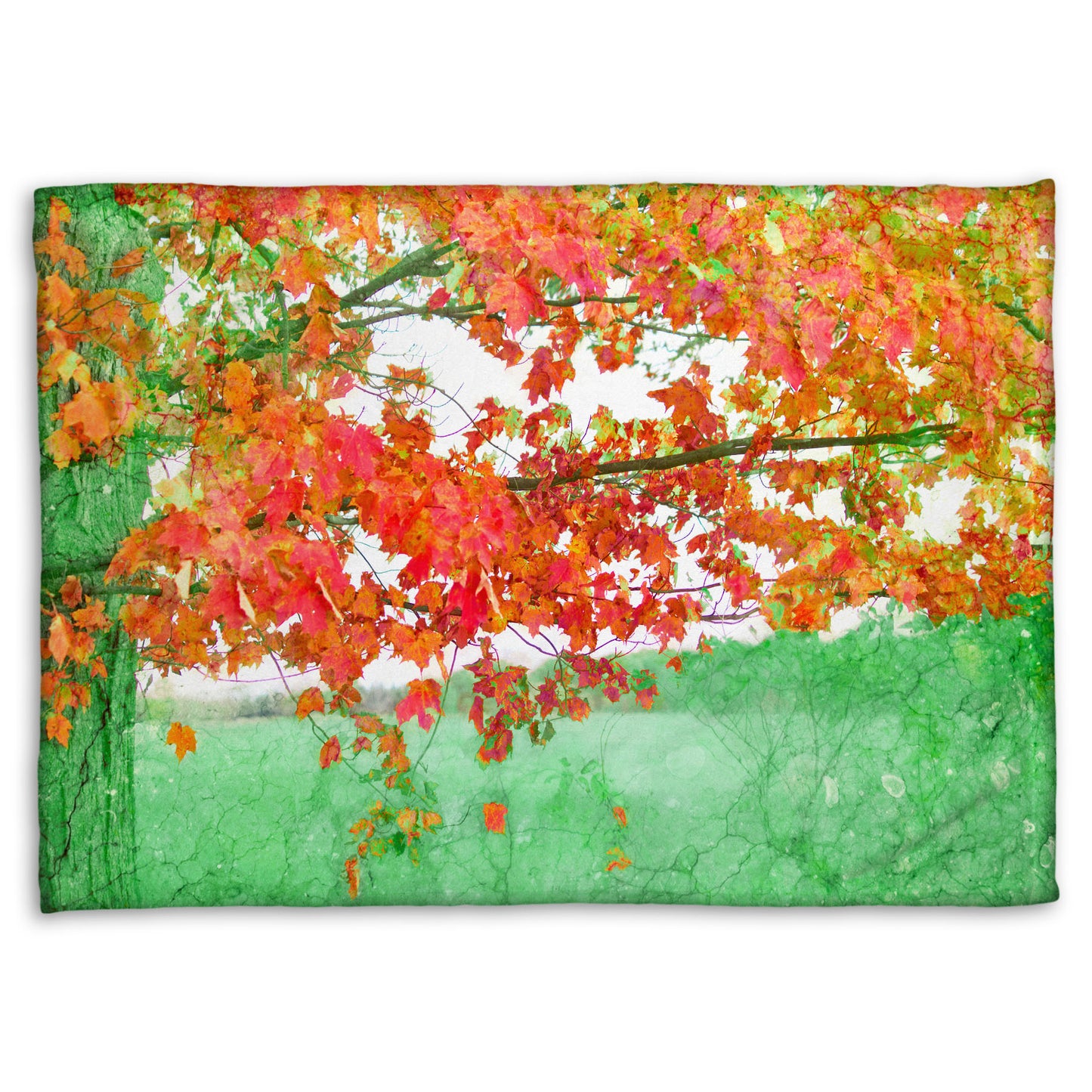 A fleece blanket designed with a photo of a tree's red leaves. The rest of the image has been edited green.