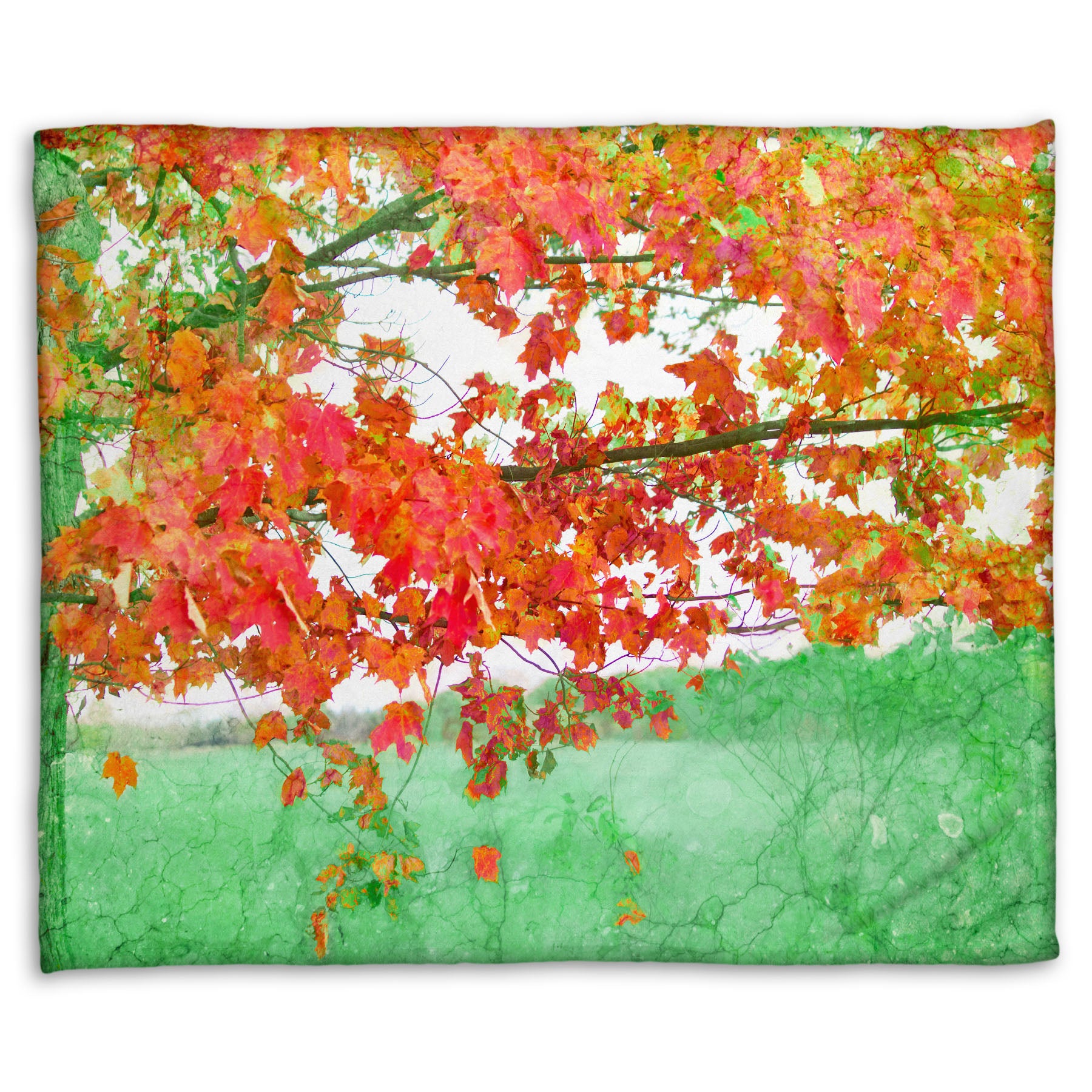 A fleece blanket designed with a photo of a tree's red leaves. The rest of the image has been edited green.