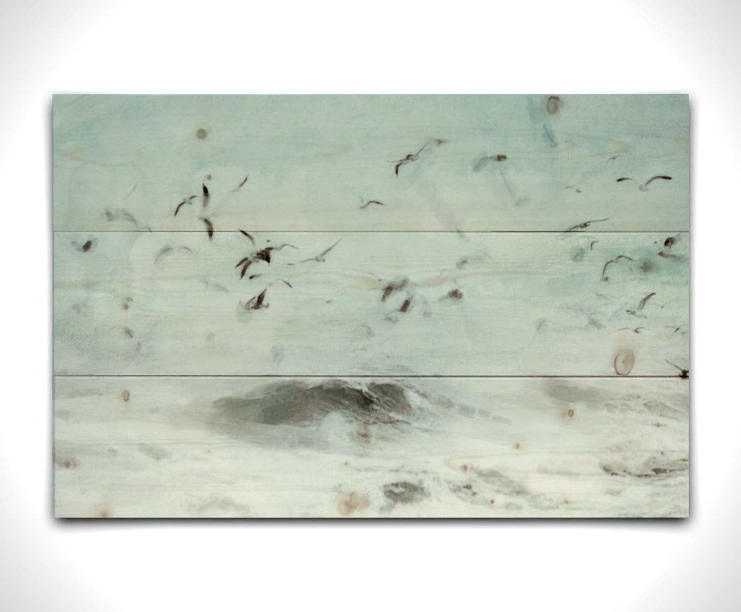 A photo edit of birds flying low over the stormy ocean, searching for a meal. Printed on a wood pallet.