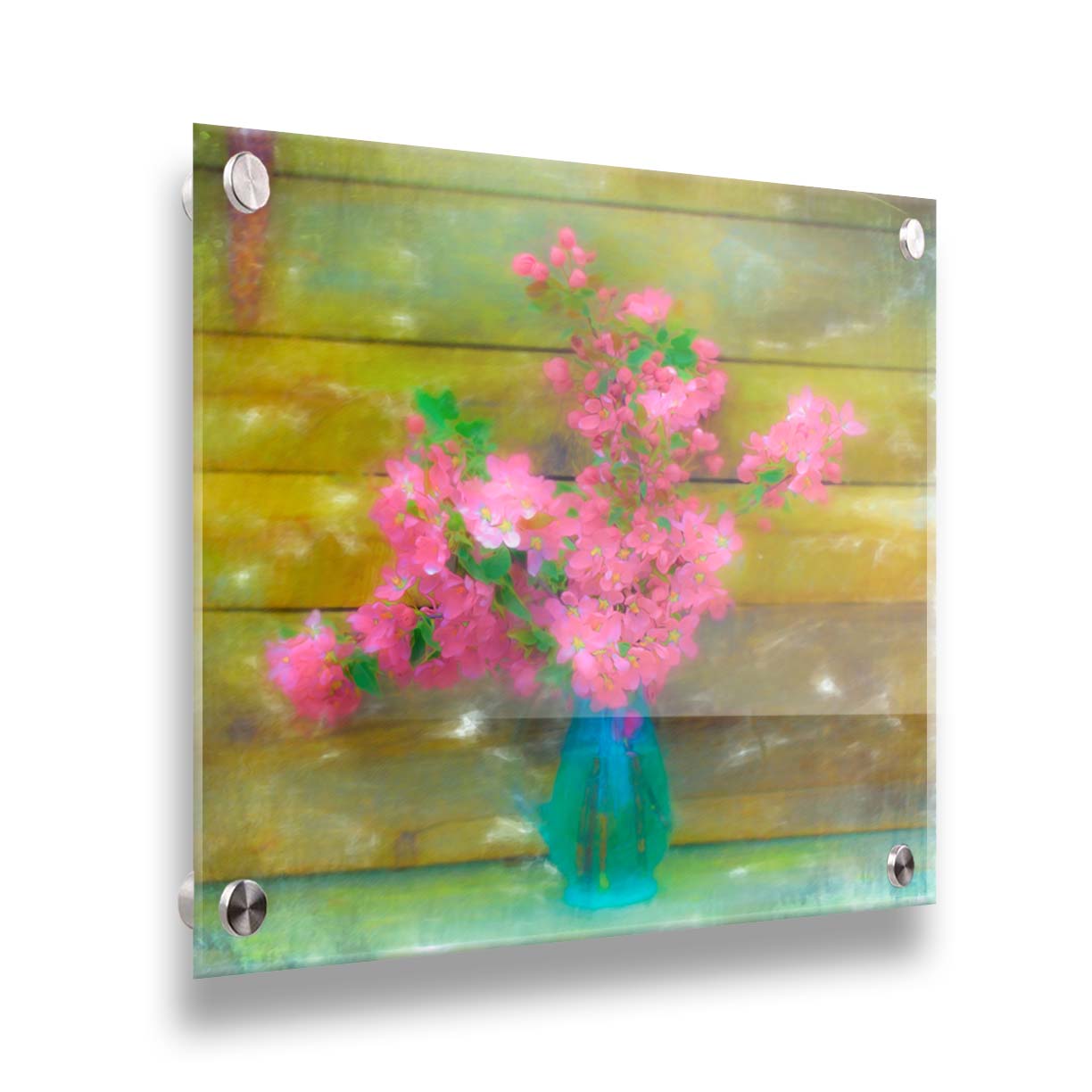 A photograph of a blue vase of bright pink flower blossoms against a yellow painted wooden wall. Printed on acrylic.