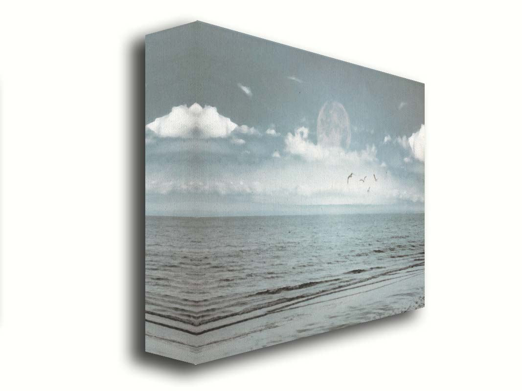 A photo of a pale blue sea with a lage moon on the horizon. Printed on canvas.