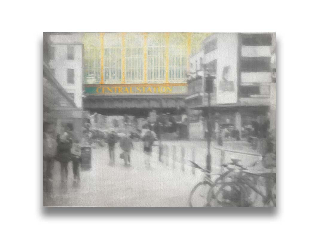 A photo taken from the streets of Glasgow, looking at the entrance to central station. The photo is in grayscale, with the exception of spot color on the face of the central station building. Printed on canvas.