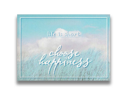 A photo of tall grass under a blue sky with white clouds. The phrase "Life is short, choose happiness" is superimposed on the image. Printed on canvas.