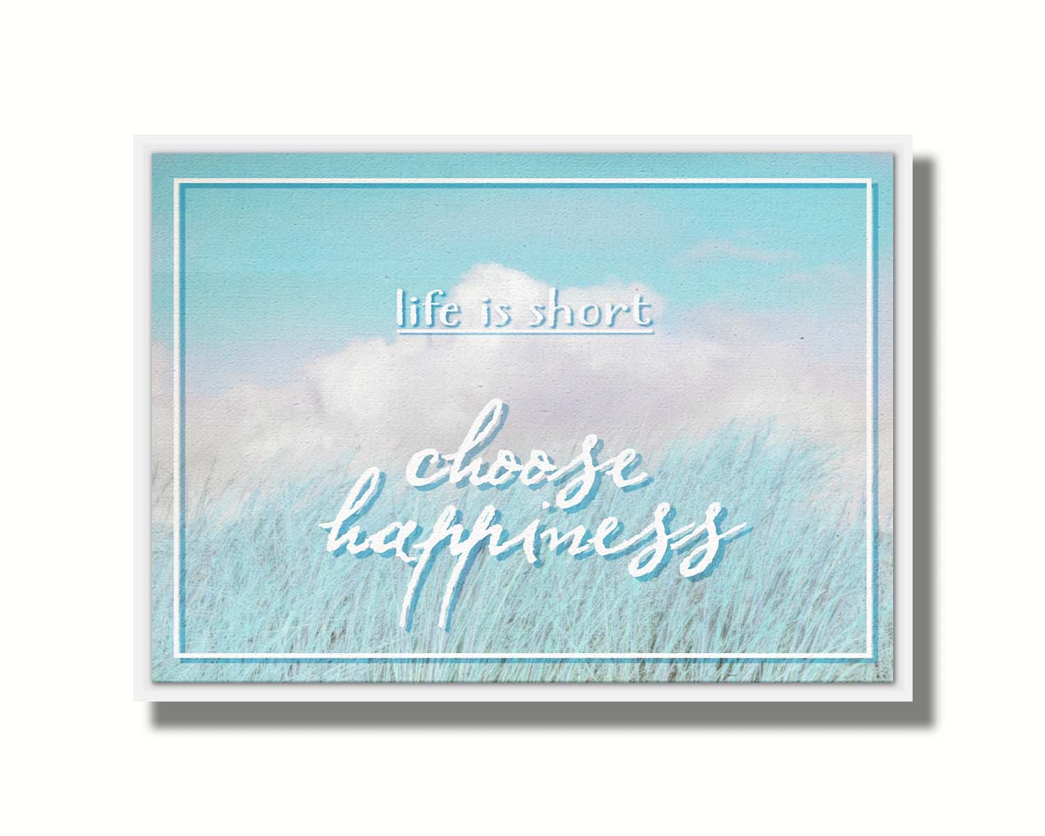 A photo of tall grass under a blue sky with white clouds. The phrase "Life is short, choose happiness" is superimposed on the image. Printed on a float frame.