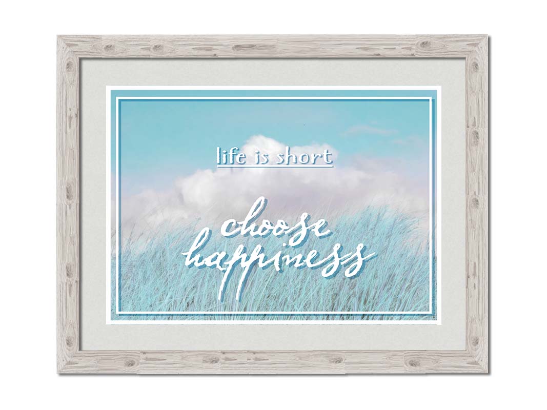 A photo of tall grass under a blue sky with white clouds. The phrase "Life is short, choose happiness" is superimposed on the image. Printed on paper, matted, and framed.