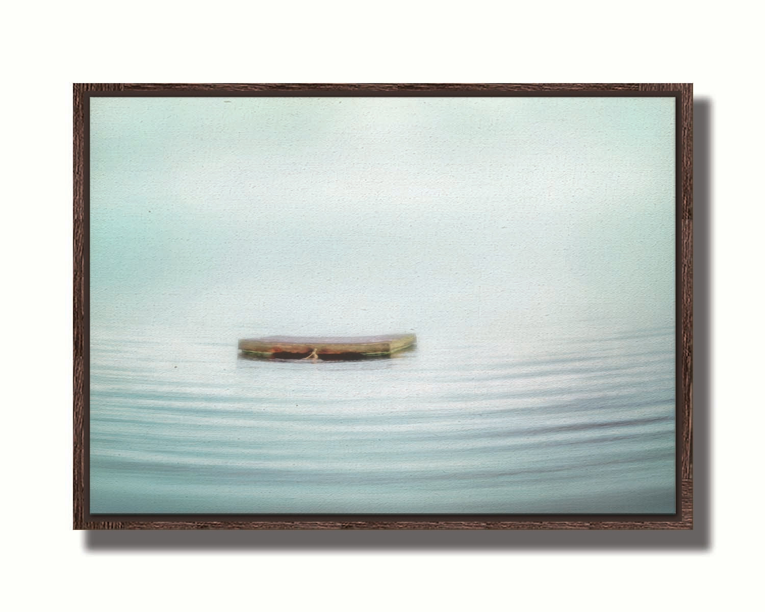 A photo of a small square dock floating on the water. The sky and water blur together. Printed on canvas in a float frame.