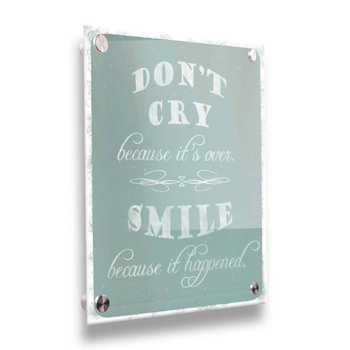 A typography design reading "Don't cry because it's over, smile because it happened" in white on a blue background. Printed on acrylic.