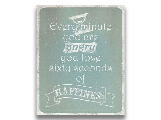 A typography design reading "Every minute you are angry you lose sixty seconds of happiness" in white on a blue background. Printed on canvas.