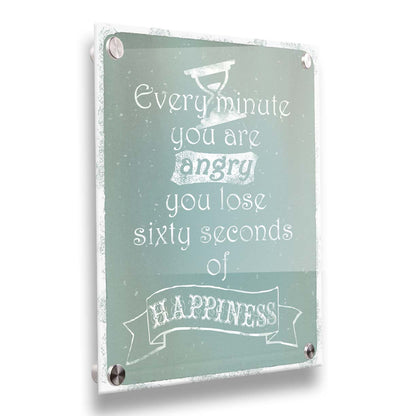 A typography design reading "Every minute you are angry you lose sixty seconds of happiness" in white on a blue background. Printed on acrylic.