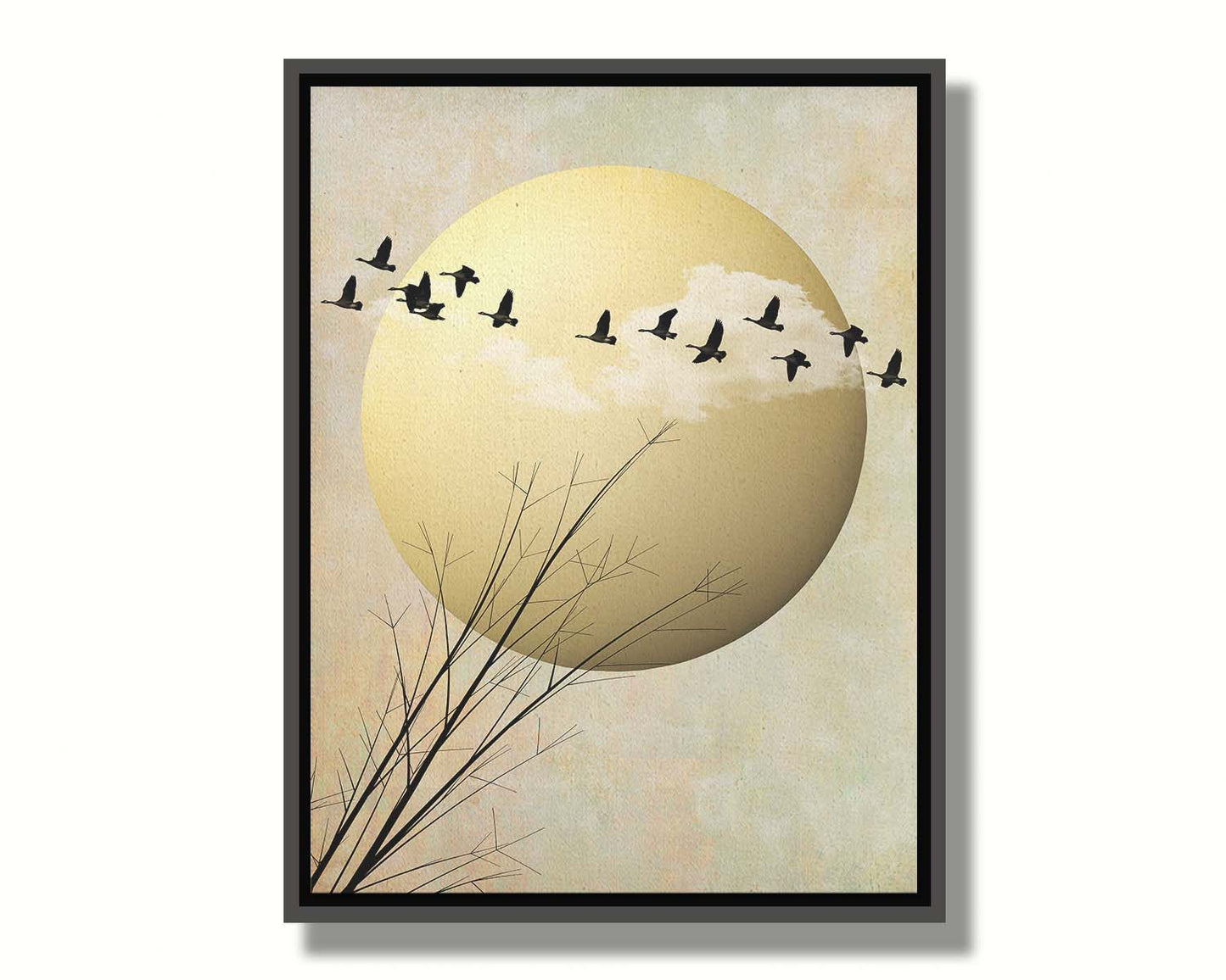 A photo collage art piece of migratory birds flying south for the winter, silhouetted against a big gold moon. Printed on canvas in a float frame.