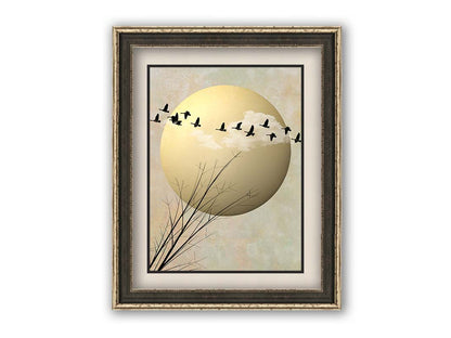 A photo collage art piece of migratory birds flying south for the winter, silhouetted against a big gold moon. Printed on paper, matted, and framed.