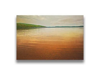 A painting of the orange sunlight reflecting off the ocean. Printed on canvas.