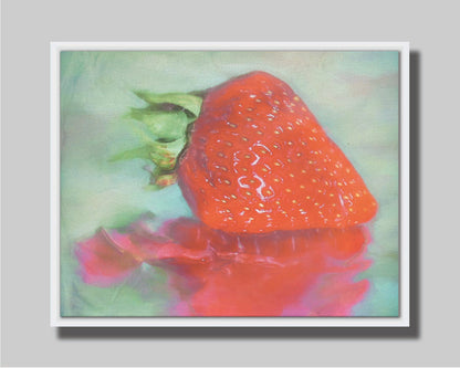 A photo of a strawberry sitting on a reflective surface. It is edited to have a painterly appearance. Printed on canvas in a float frame.