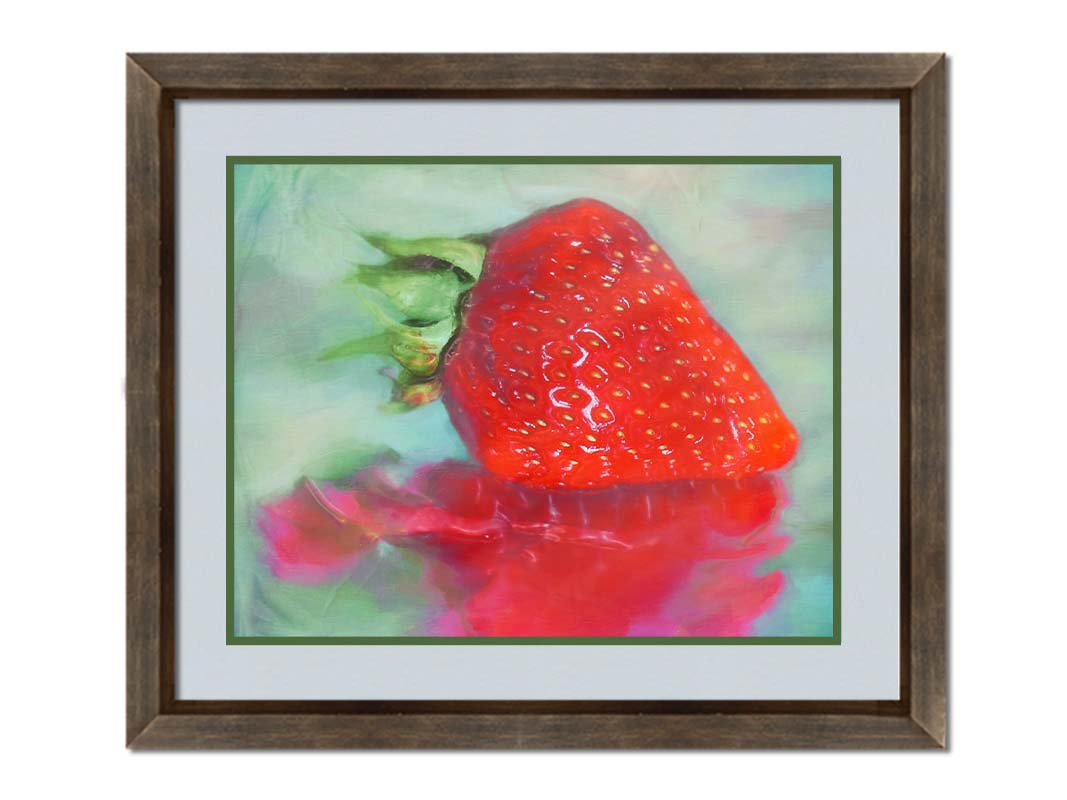 A photo of a strawberry sitting on a reflective surface. It is edited to have a painterly appearance. Printed on paper, matted, and framed.