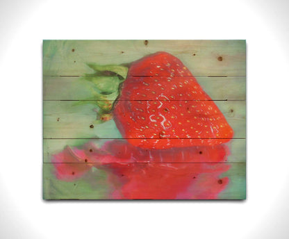 A photo of a strawberry sitting on a reflective surface. It is edited to have a painterly appearance. Printed on a wood pallet.